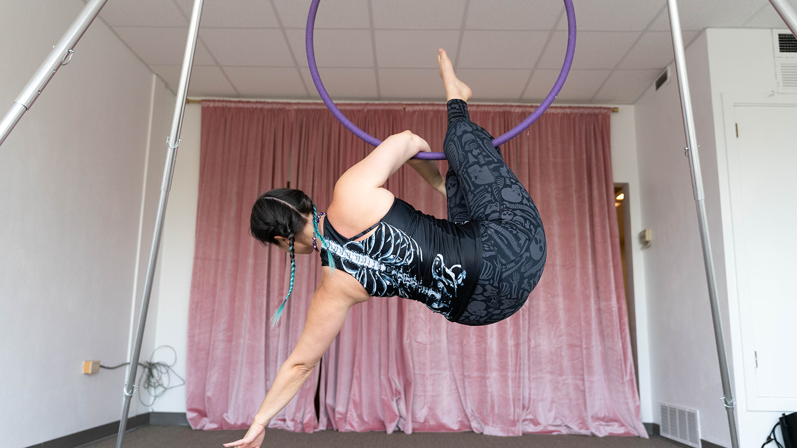 Aerialist performing on aerial hoop